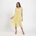Pale yellow cutwork dress