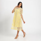 Pale yellow cutwork dress