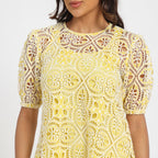 Pale yellow cutwork dress